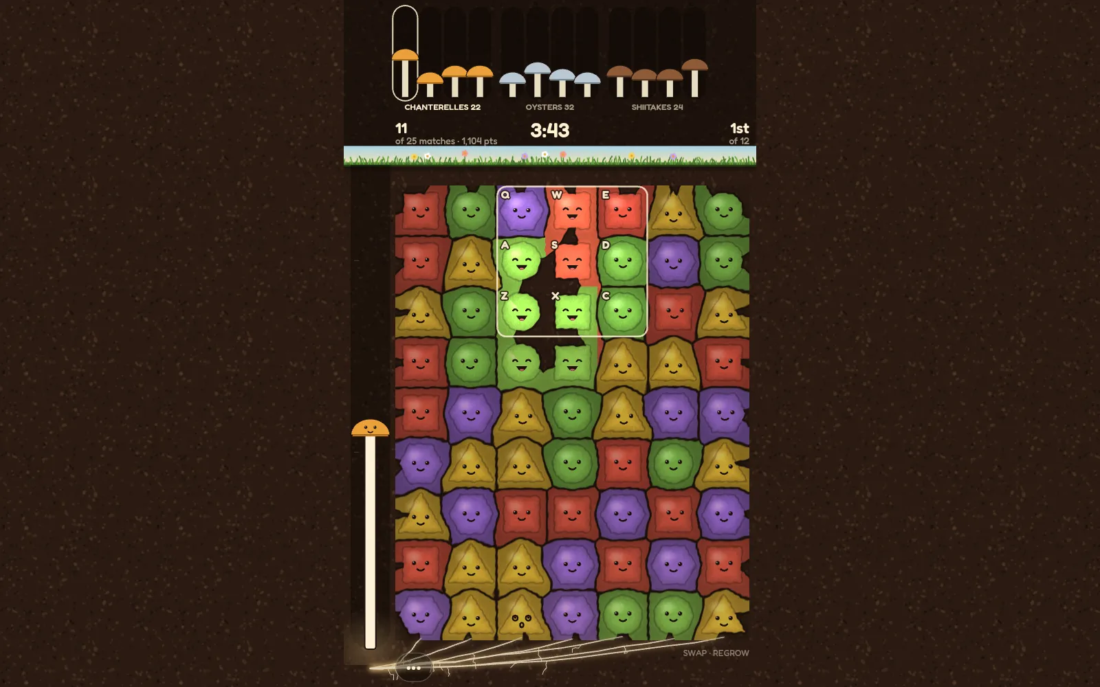 Playing on a laptop: a 3 × 3 window of keys from Q to C outlined on a board of smiling clumps, a match of green clumps melting away inside it