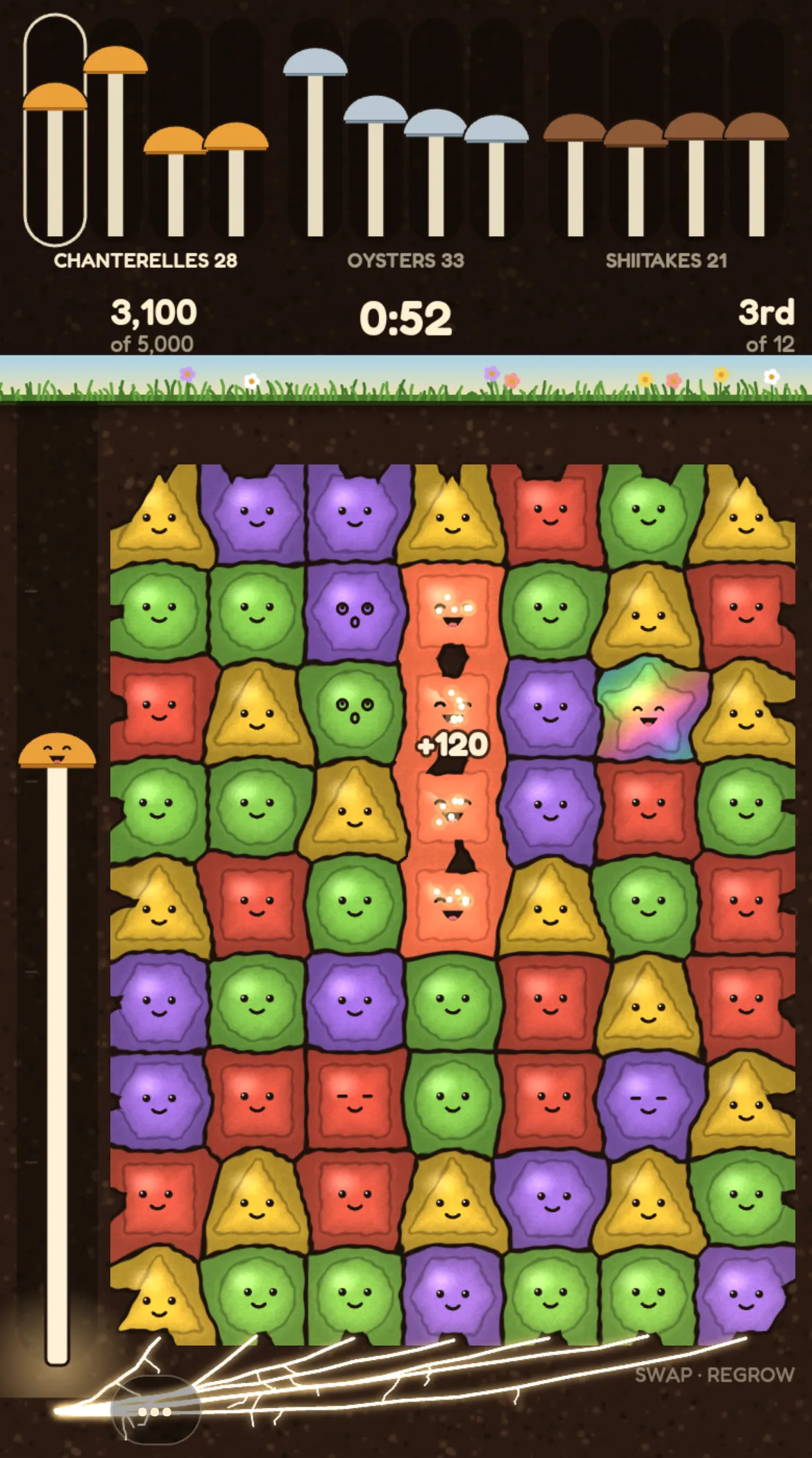 A phone screen of smiling, colourful mushroom tiles in a match grid, with chanterelle, oyster and shiitake stalks growing along the top and a 0:52 timer